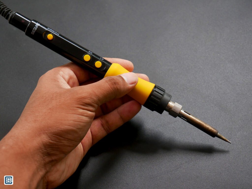 SEQURE SQ-A110 Digital Soldering Iron held on the hand